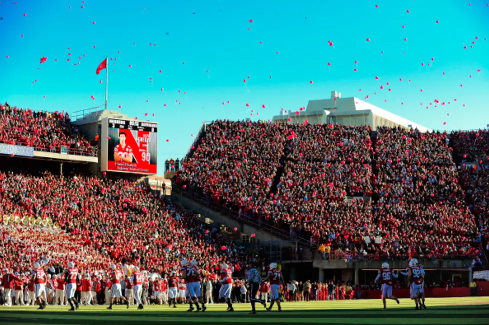 Someone Trying to Burst Traditional Red Balloon Release at Nebraska Football Games
