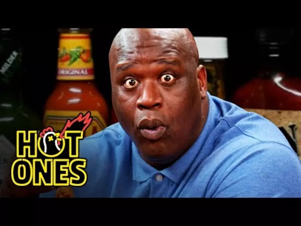 Shaq Tries to Not Make a Face While Eating Spicy Hot Wings