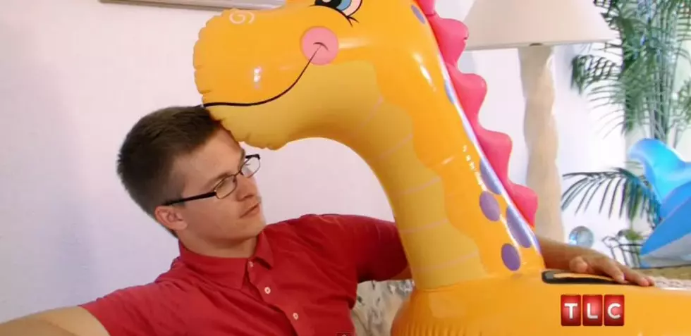 Man in Love with 15 Inflatable Pool Toys [VIDEO]