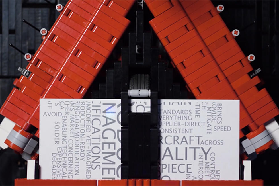 Lego Machine Builds and Launches Paper Airplane