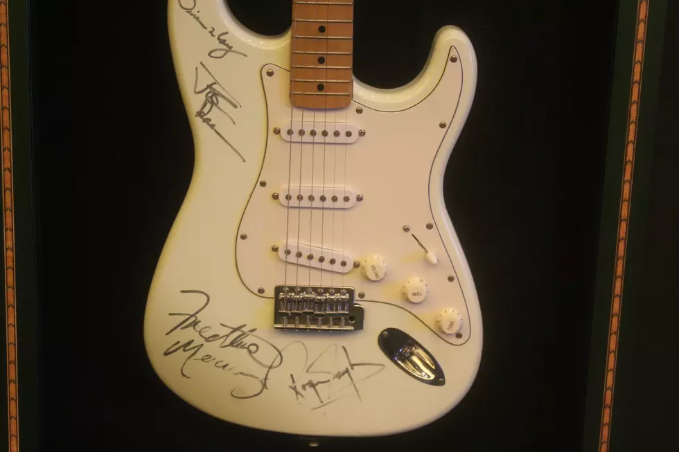 Maine Cruise Ship Visit Brings Autographed Queen Guitar