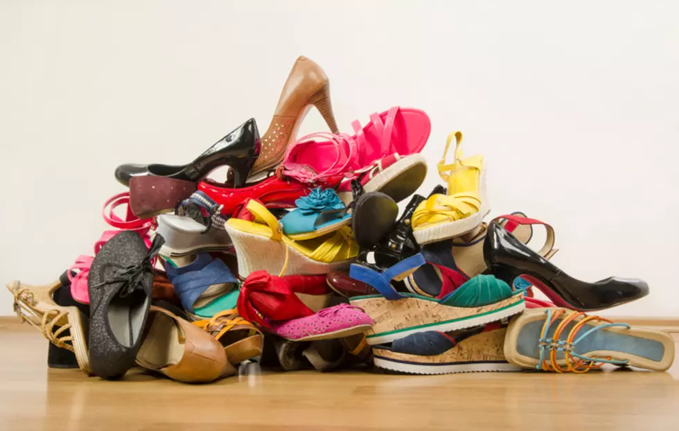 Close up on big pile of colorful woman shoes.