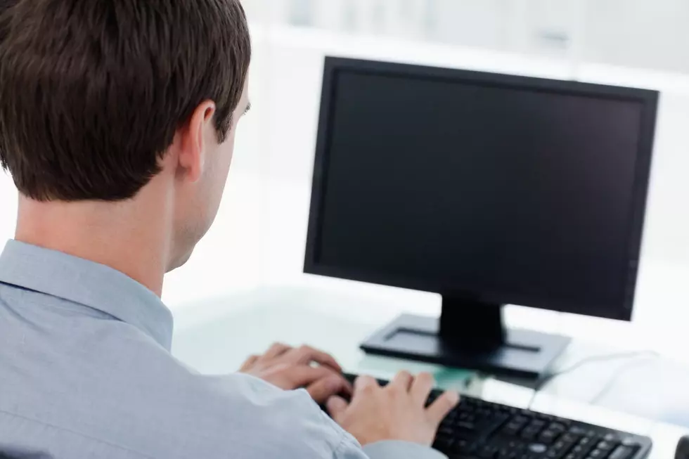 Back view of a businessman working with a computer