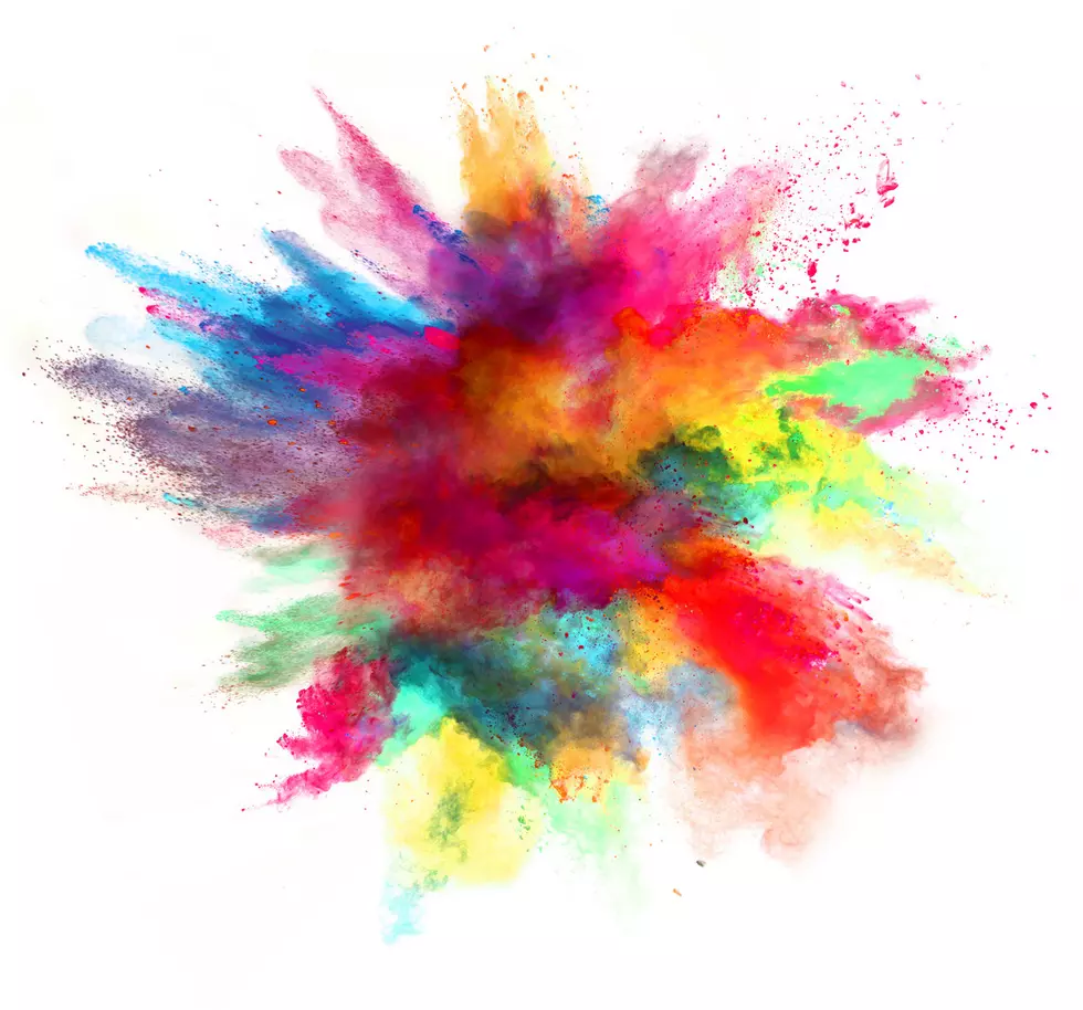 Explosion of colored powder, isolated on white background