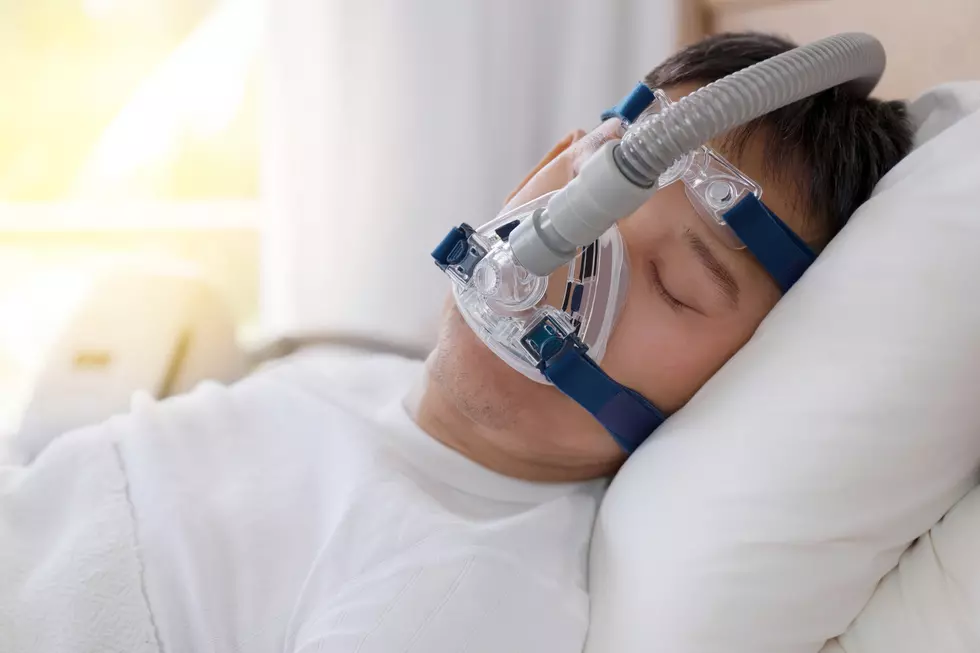 Healthy senior man sleeping deeply, happy on his back without snoring