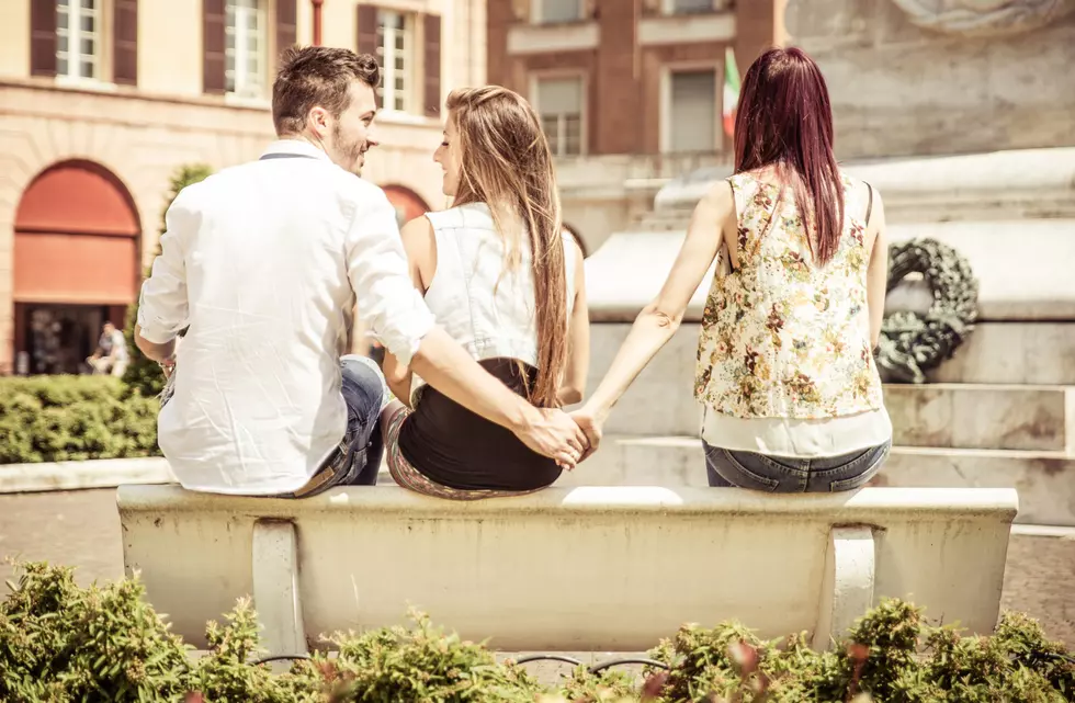 man cheating on her girlfriend at the park