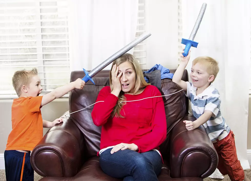 Young Mother overwhelmed by her kids