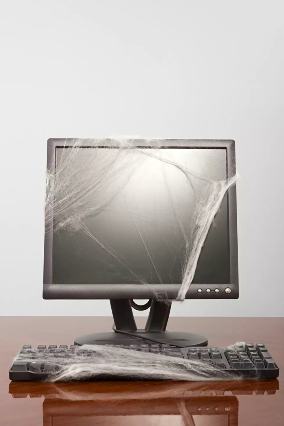Computer covered in cobweb