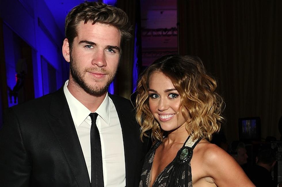 Miley Cyrus + Liam Hemsworth Make the Internet Think They’re Married [PHOTOS]