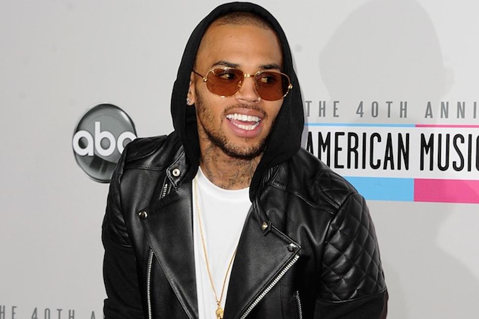 Chris Brown Shows How Many Joints Will Fit in His Stupid Piehole at Once [PHOTOS]