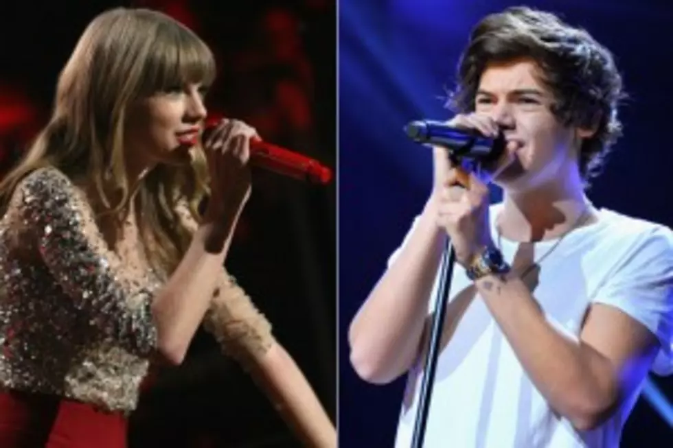 Taylor Swift and Harry Styles Get Lovie Dovie at Concert [Video]