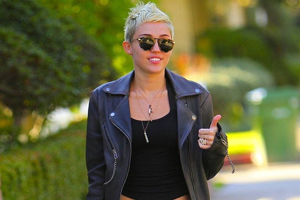 Miley Cyrus Tweets a Picture of Herself in a Onesie – With Her Engagement Ring Back On [PHOTO]