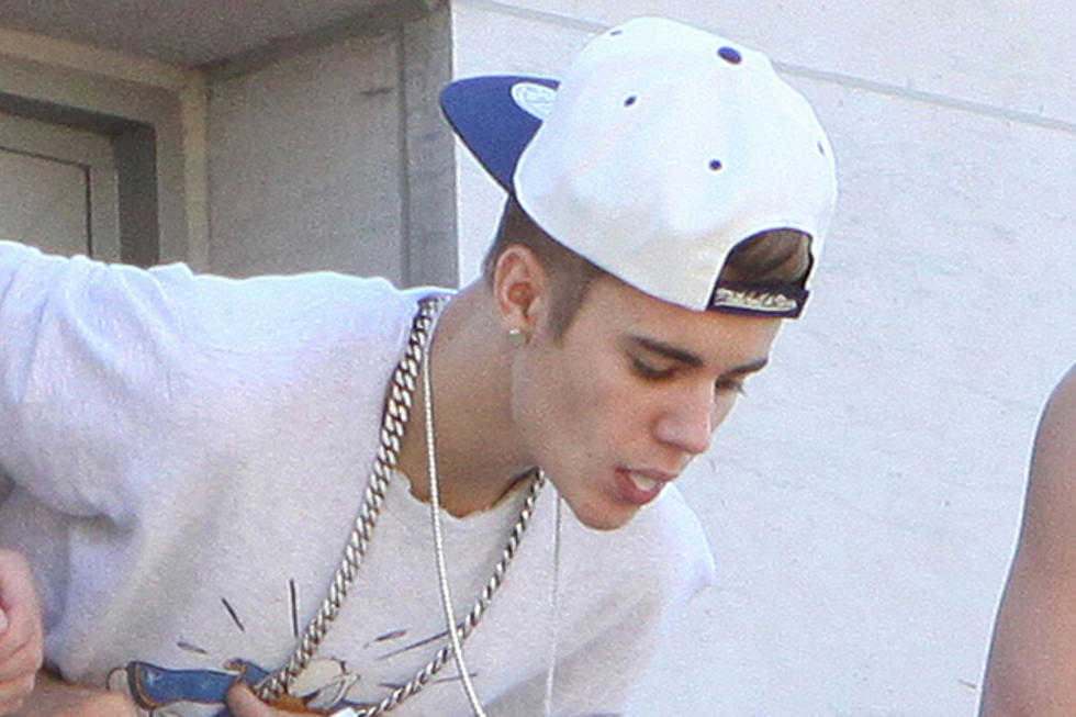 Did Justin Bieber Spit on Beliebers From a Balcony?
