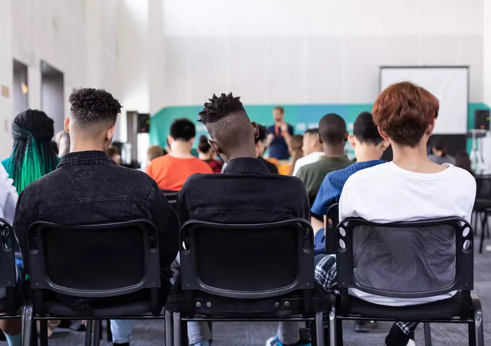 College students sitting in a classroom - Photo by Sam Balye on Unsplash