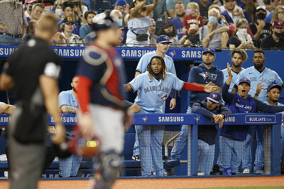 Blue Jays use 9-run 5th to beat skidding Red Sox 12-4