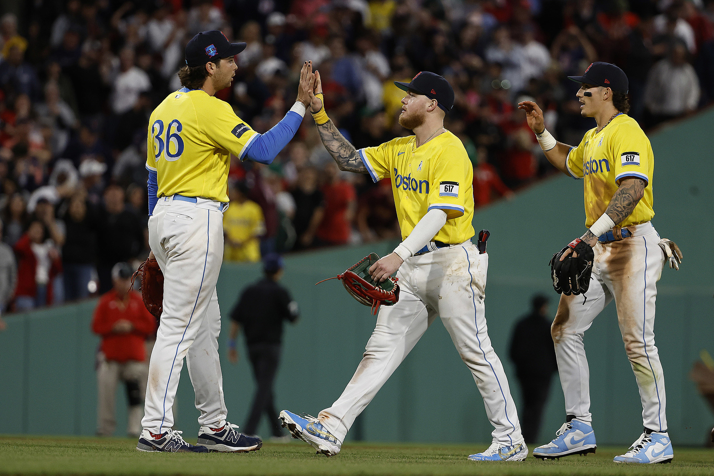 Why are the Boston Red Sox wearing yellow and blue uniforms today?