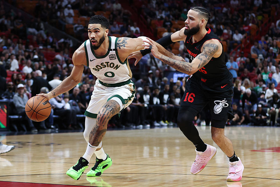Tatum has 26 points and Celtics withstand late rally to beat Heat 110-106