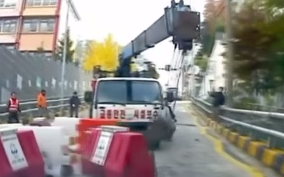 Watch Korean Driver Slam Into Reverse to Avoid Runaway Truck