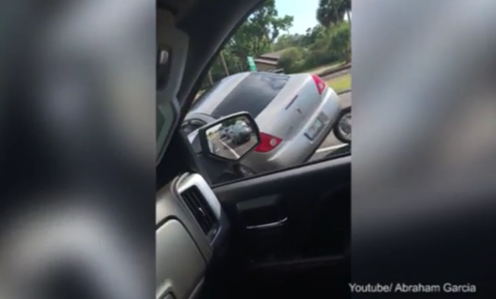 Biker Ran Over By Angry Motorist During Road Confrontation