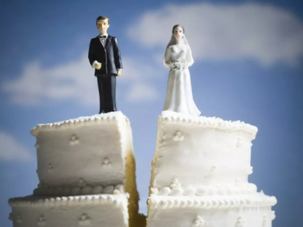 Divorced Couple Looks At Their Wedding Photos