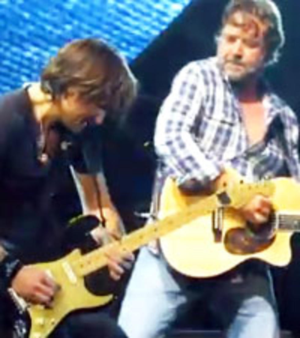 Russell Crowe Helps Keith Urban Give Fans a Little Cash