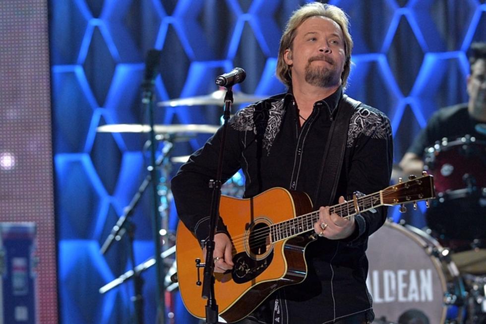 Story Behind the Song: Travis Tritt, ‘Here’s a Quarter (Call Someone Who Cares)’