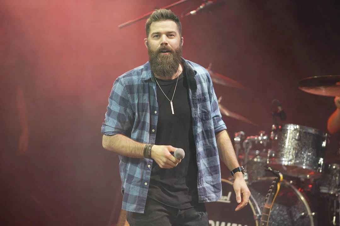 A moody, unfocused shot of Jody Davis, guitar player for The Newsboys at  the Spirit West Coast festival in Del Mar, California Stock Photo - Alamy