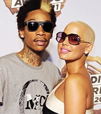Amber Rose Covers Tattoo of Ex Wiz Khalifa With Another Man