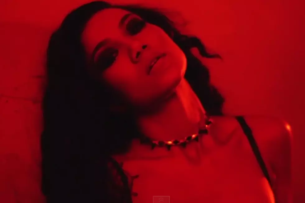 Jhene Aiko Plays a Seductress in New 'Wading' Video