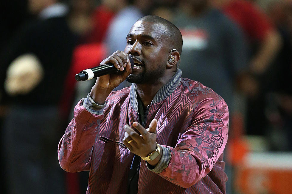 Kanye West Attempts to Hide His Smile With a Mean Mug at Basketball Game [VIDEO]