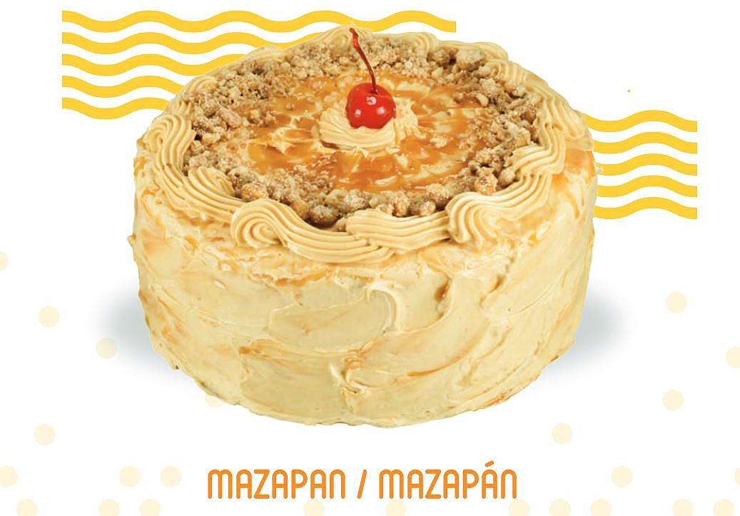 Exquisite mazapan cake decorated with whipped cream and walnut pieces in  close up. Stock Photo | Adobe Stock