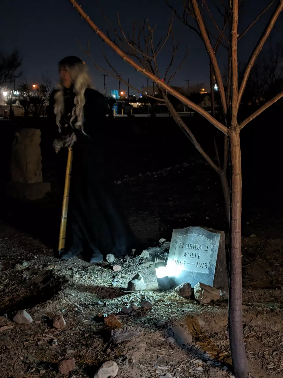 Heather Shade stands in front of the grave of a historical El Paso figure at the Concordia Cemetery (F.A. Montejano)