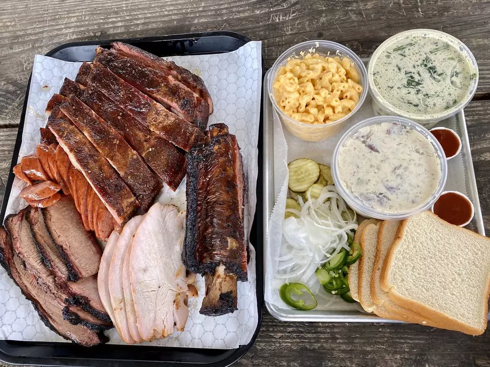 A variety plate with beef and pork ribs, other meats, and sides (Yelp)
