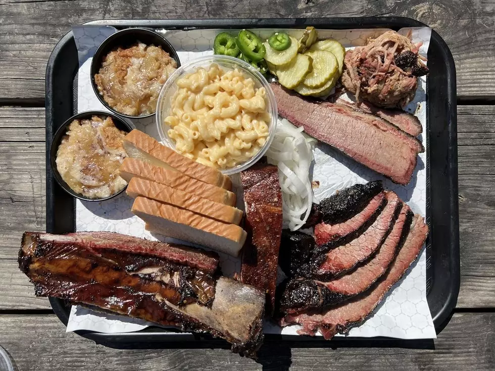 A decadent tray of meats and sides (Yelp)