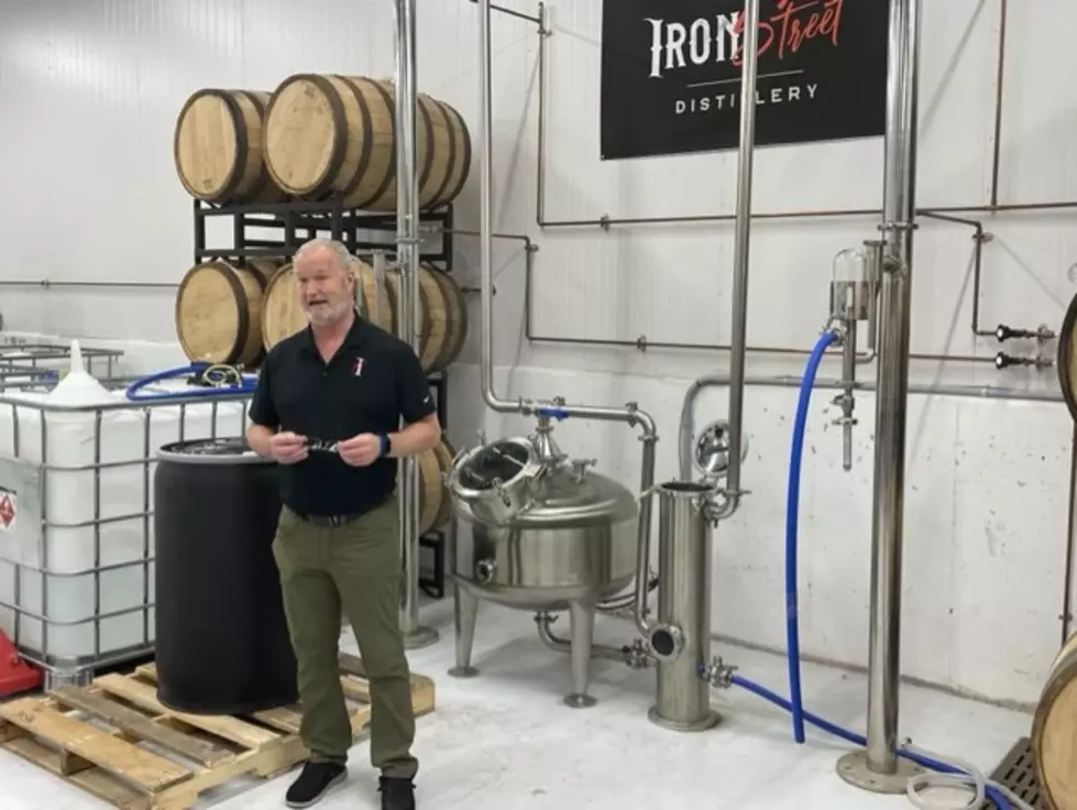Photo by Brooks O'Brian. Pictured: John, one of the owners, explaining the distilling process.