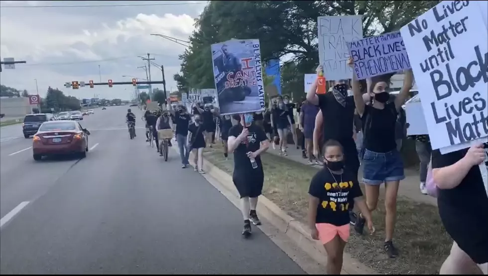Group Of Protestors March Down Westnedge Ave. On July 4th