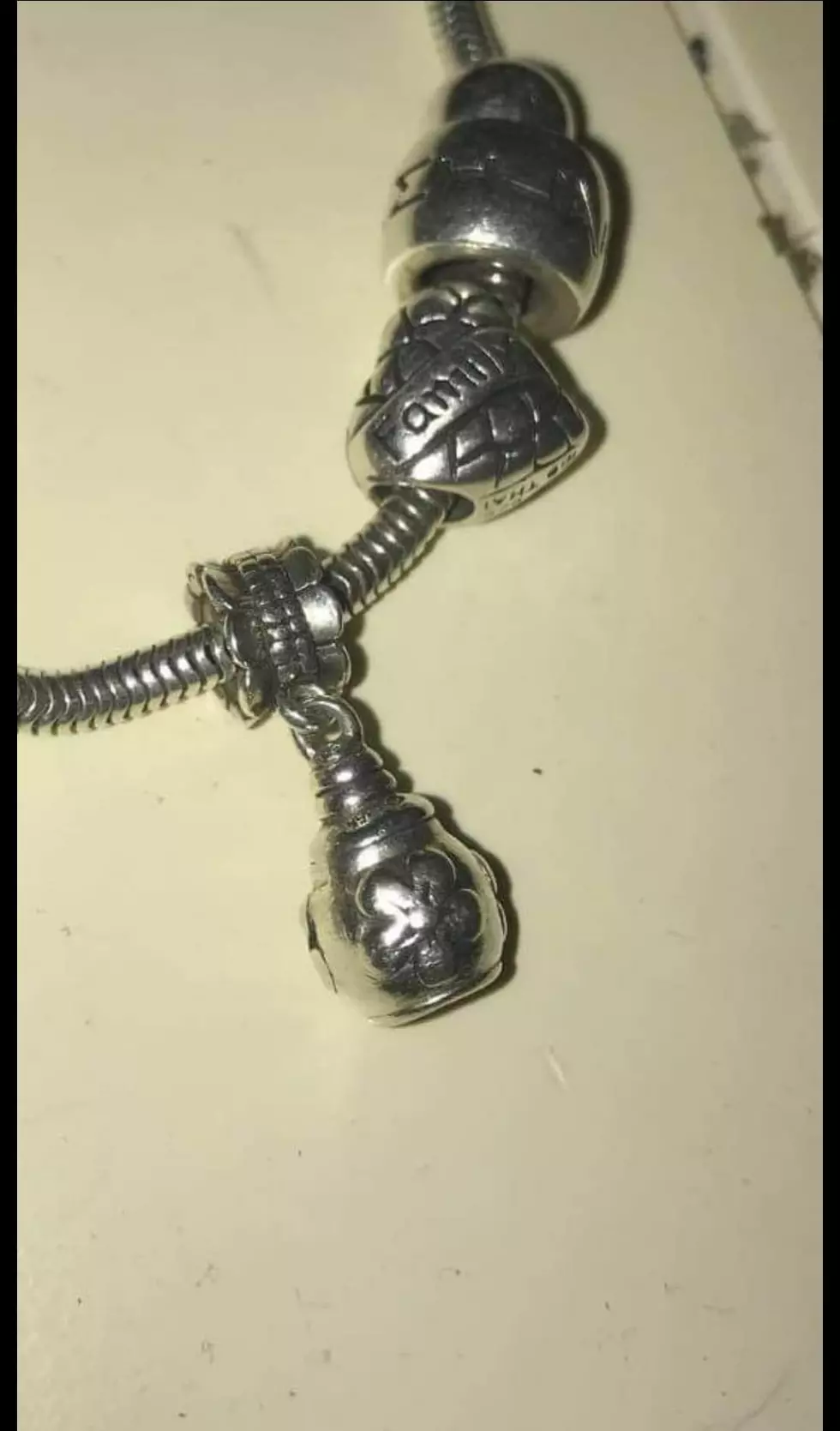 closeup of the charm containing Josh Thomson's ashes