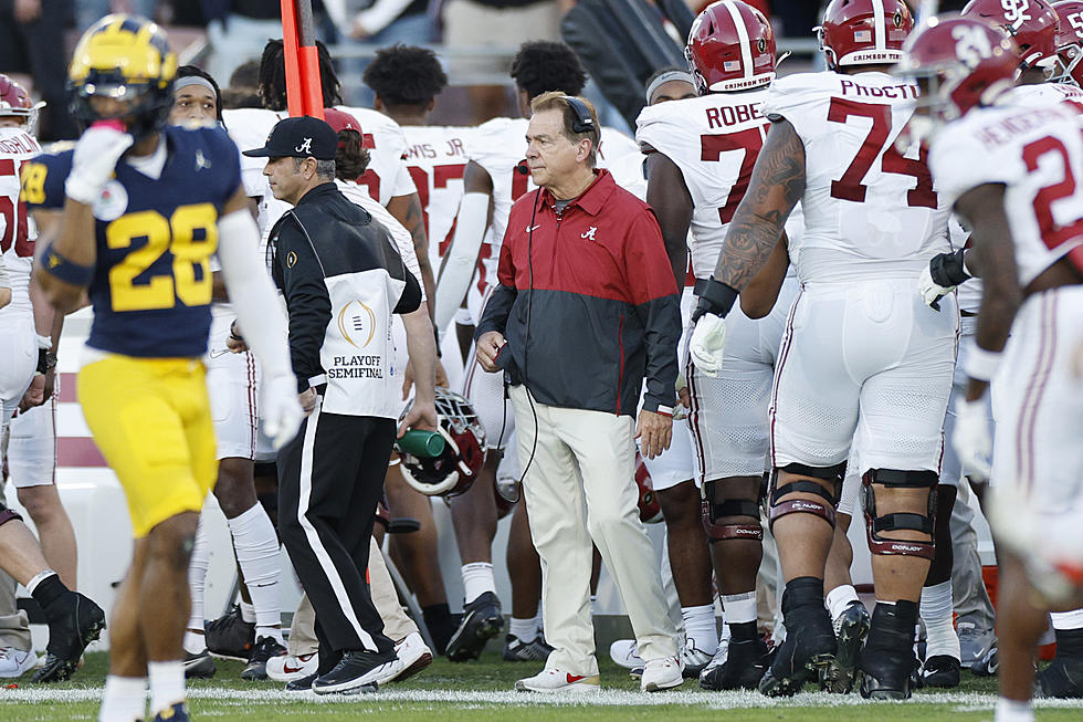 Michigan Fan Pays Respect at Statue of Now Retired Nick Saban