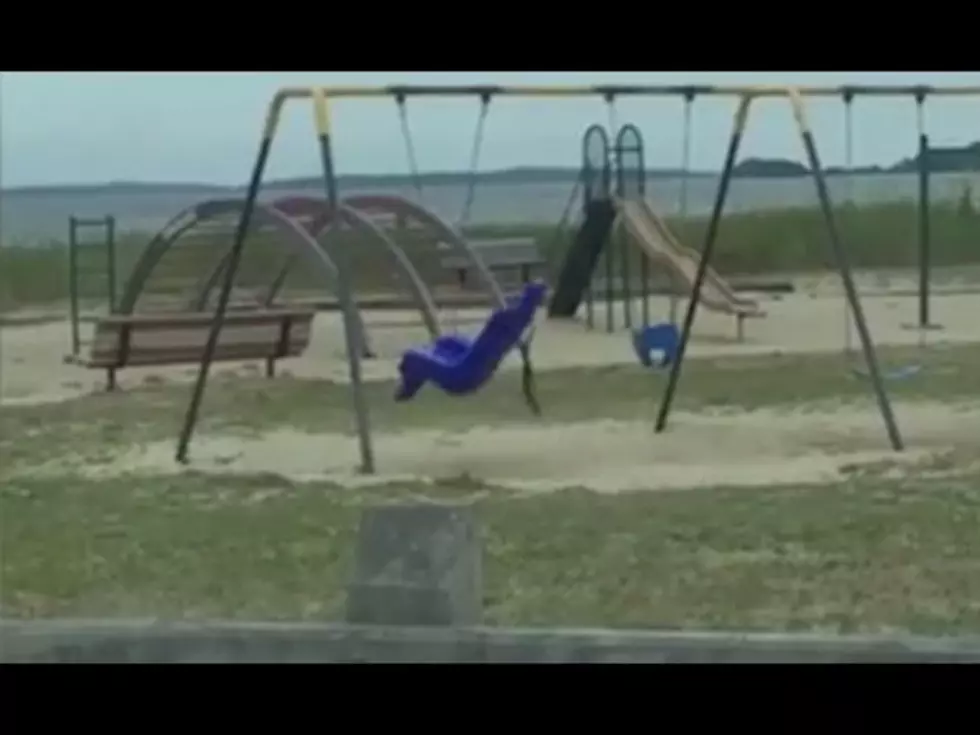 Dad Films Ghost Swinging on Playground