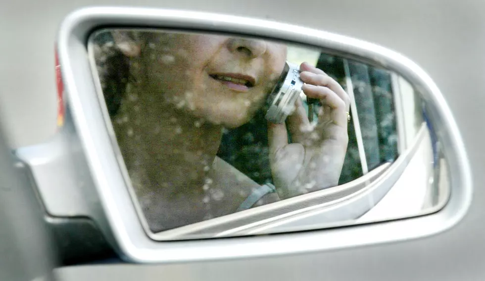 Should Holding a Cell Phone While Driving Be Illegal in Meridian?