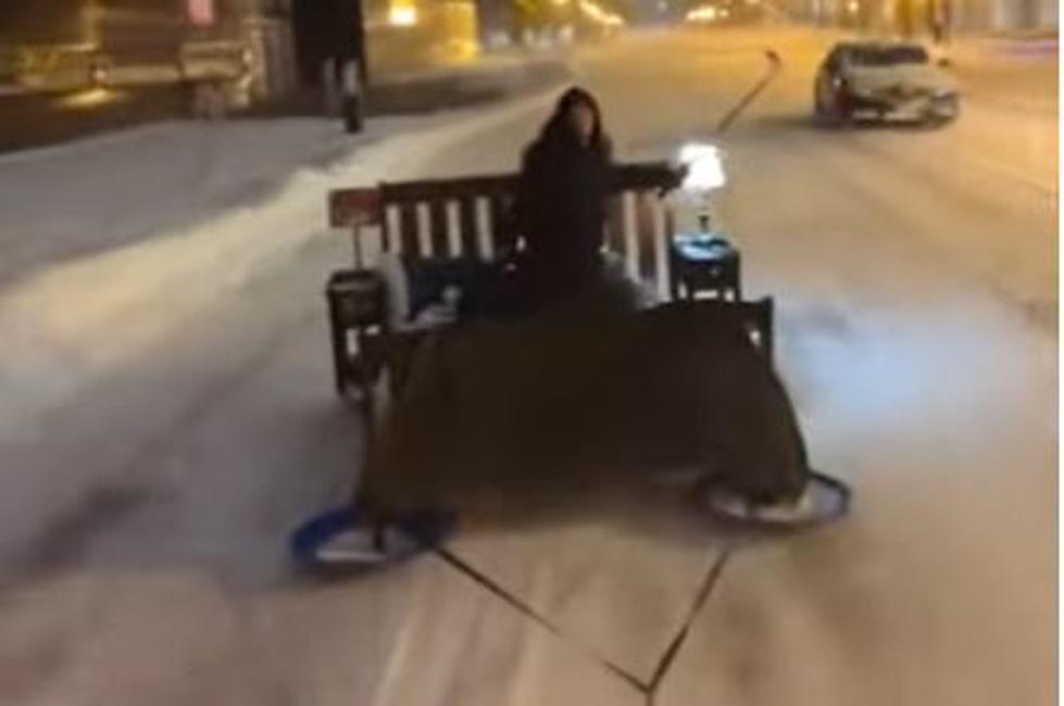 (WATCH) Guy Cruises Minneapolis Streets On A Bed Sled