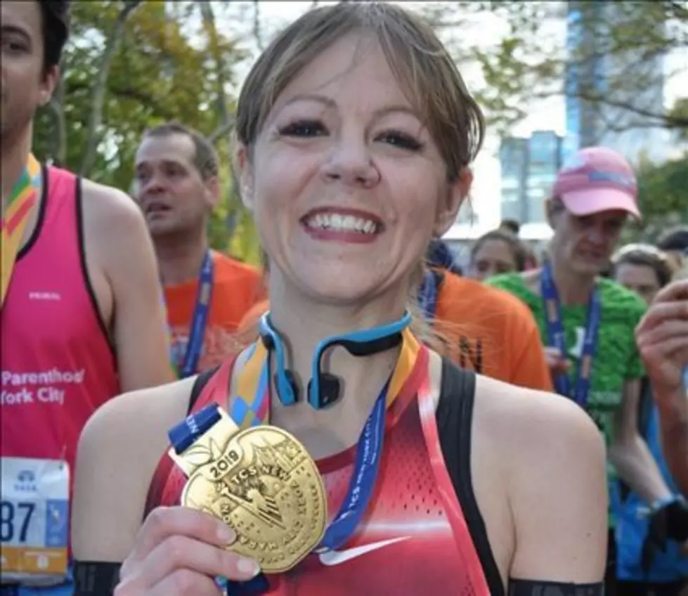 The REAL Story Behind This New York Marathon Finish Line Photo