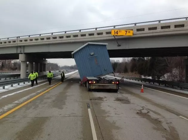 Semi With Tall Load Smashes into Overpass in Southeast Michigan