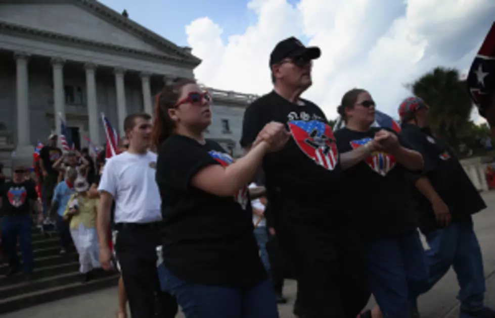 Black Cop Assists KKK Rally Supporter
