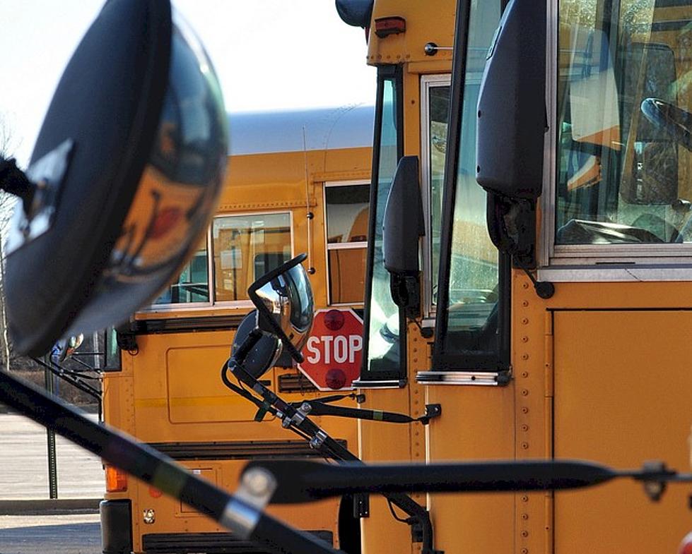 School Bus Tips on Slippery Road Near Little Falls