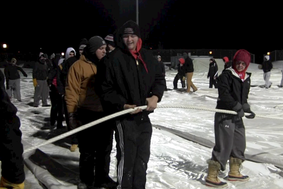 Total Team Effort Setting Up Dome At Husky Stadium [VIDEO]