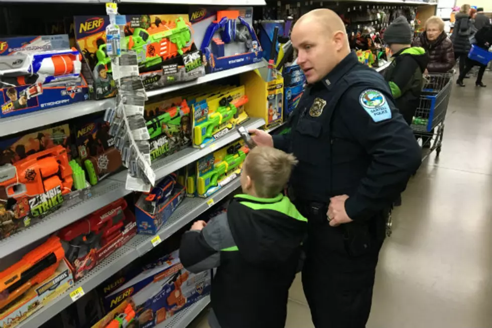 Local Police Officers Spread Holiday Cheer With Annual ‘Shop With A Cop’ Event