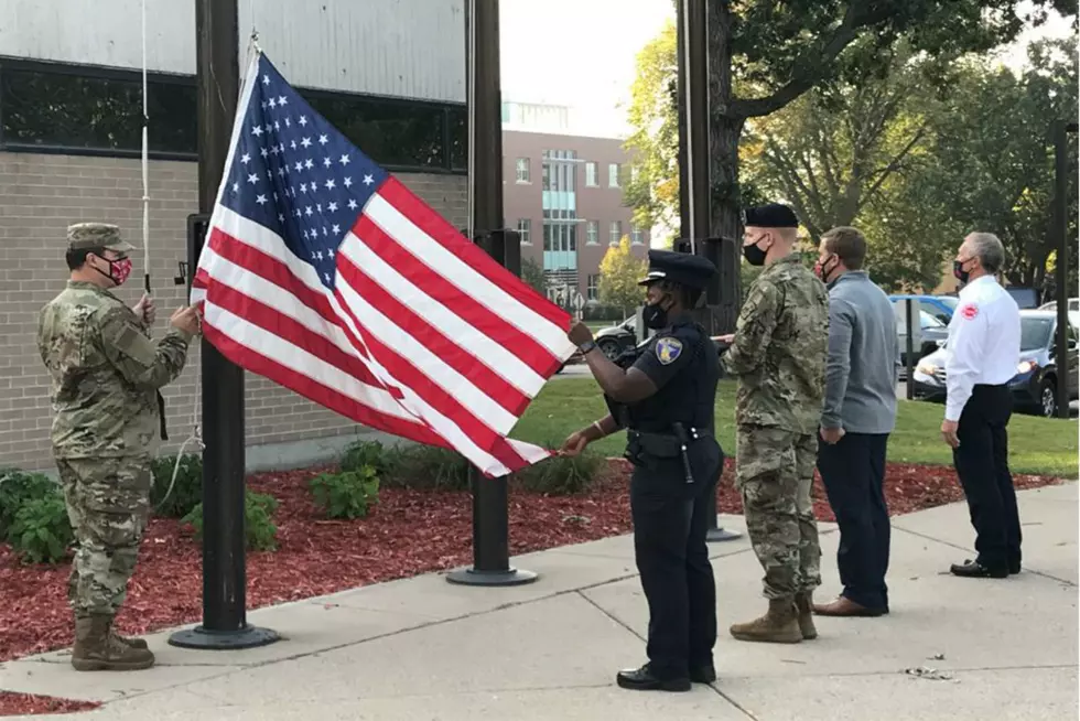 Dozens Attend Flag Raising to Observe 911 Anniversary