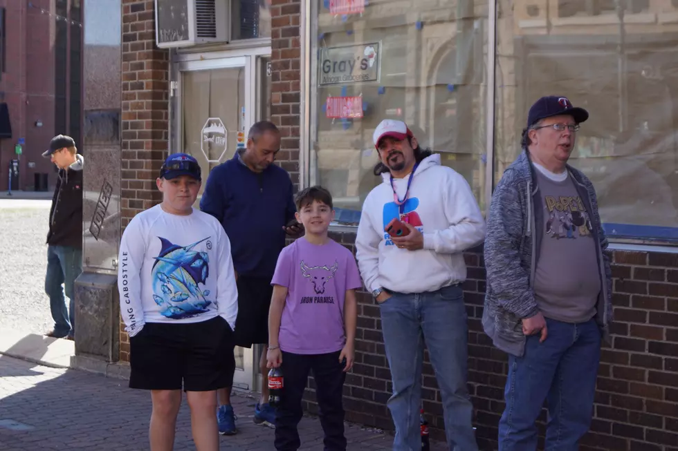 Michael Piza and his two sons waiting outside Granite City Comics for Free Comic Book Day, PHOTO by Paul Habstsritt, WJON