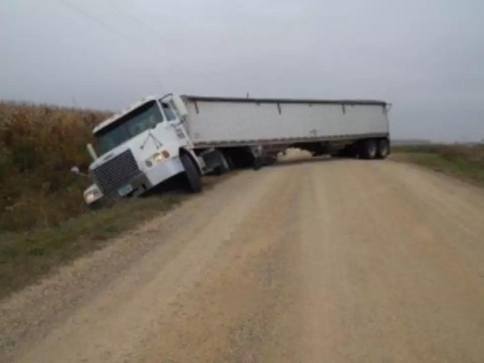 Road Gives out to Semi Loaded with Beans